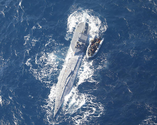 The semi-submersible vessel eventually sank in the Atlantic, taking with it 35 bales of cocaine. Photograph: Forca Aerea Portuguesa/AFP/Getty Images