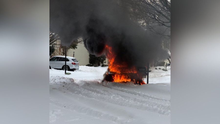Photos: Pickup truck stuck in snow catches fire in Montgomery County