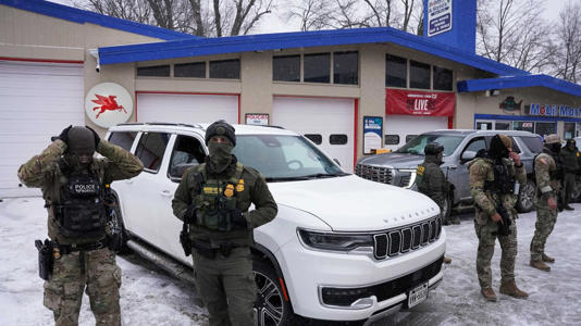 Federal agents of commander Greg Bovino's team make a stop at a gas station, as immigration enforcement continues after a U.S. Immigration and Customs Enforcement (ICE) agent fatally shot Renee Nicole Good on Jan. 7, in Minneapolis, Minnesota on Jan. 21, 2026. REUTERS/Seth Herald
