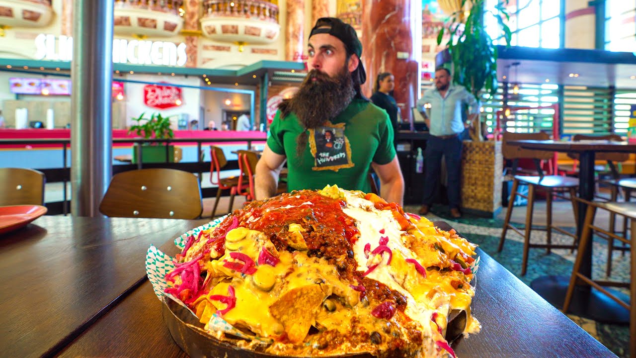Attempting an unexpectedly spicy nacho mountain challenge | BeardMeatsFood