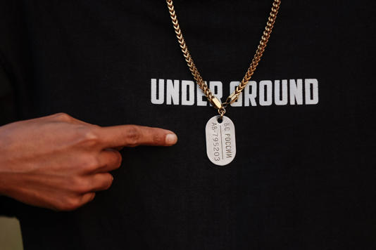 Mohan Miajee, 29, who escaped after fighting for the Russian army, shows his Russian military dog tag in Munshiganj, Bangladesh, Dec. 9, 2025. (AP Photo/Rajib Dhar) (Copyright 2026 The Associated Press. All rights reserved.)