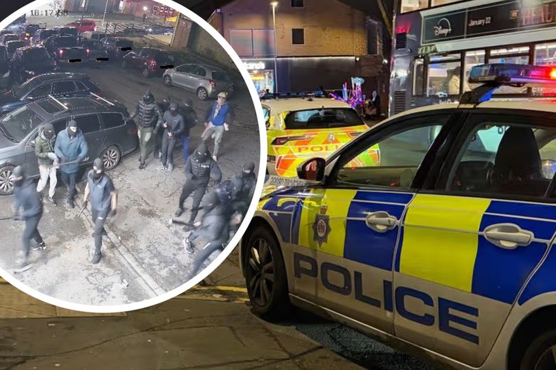 Police storm Bradford street after 17 masked men attack garage