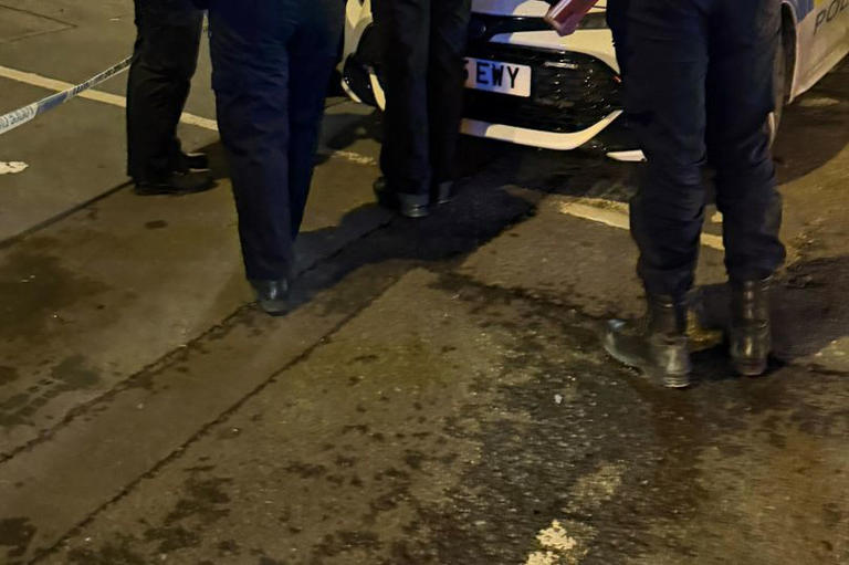 Police storm Bradford street after 17 masked men attack garage