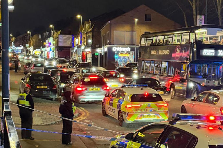 Police storm Bradford street after 17 masked men attack garage