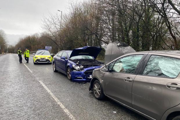 Two rushed to hospital after head-on car crash on busy route