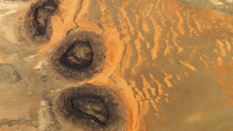 Rocky rings adorned with ancient artwork wear a magma 'hat' in the ...