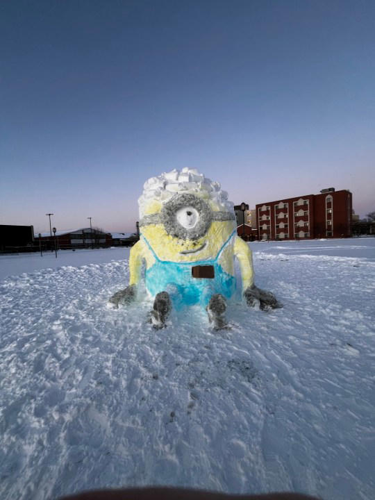 Students build giant minion out of snow on Vincennes University campus