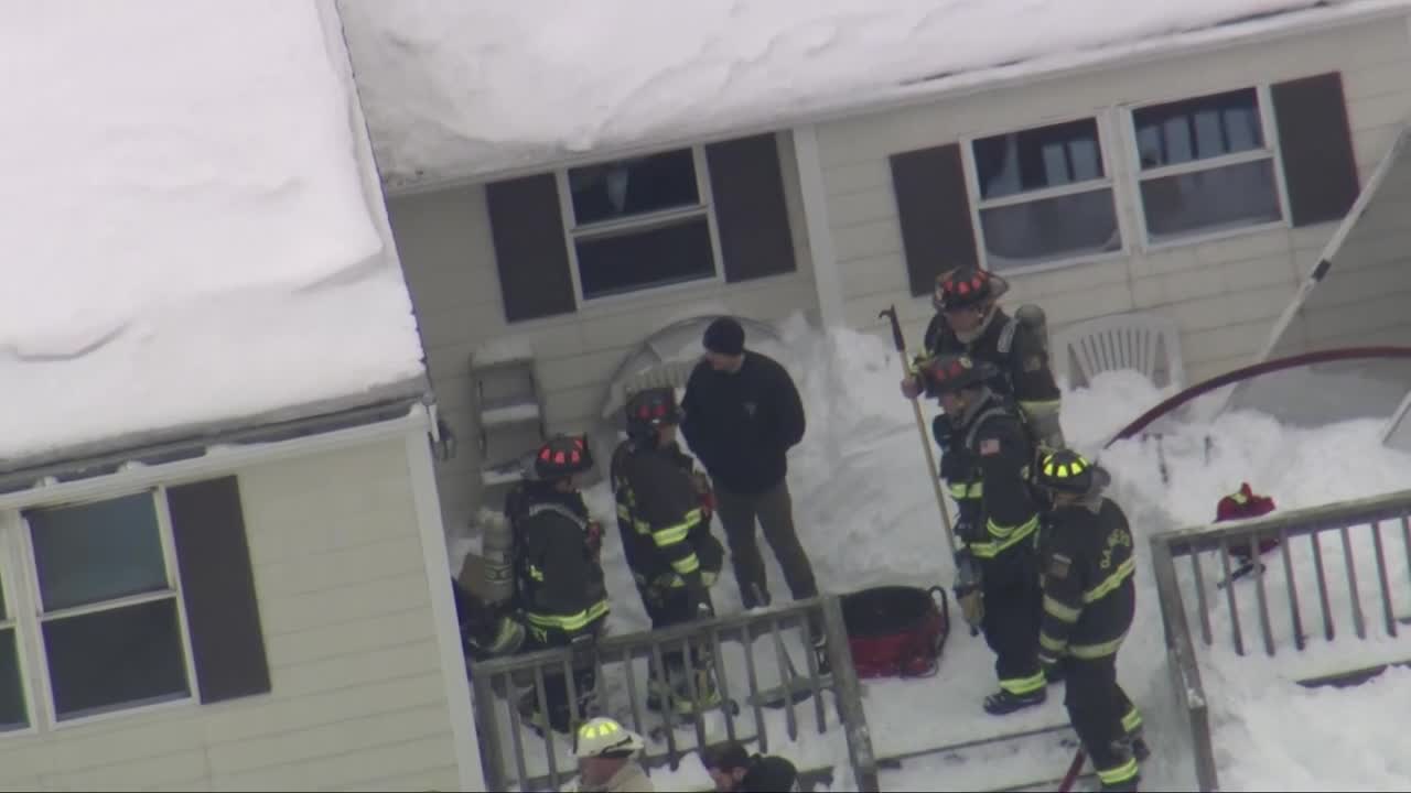 Firefighters pull person from Danvers house fire