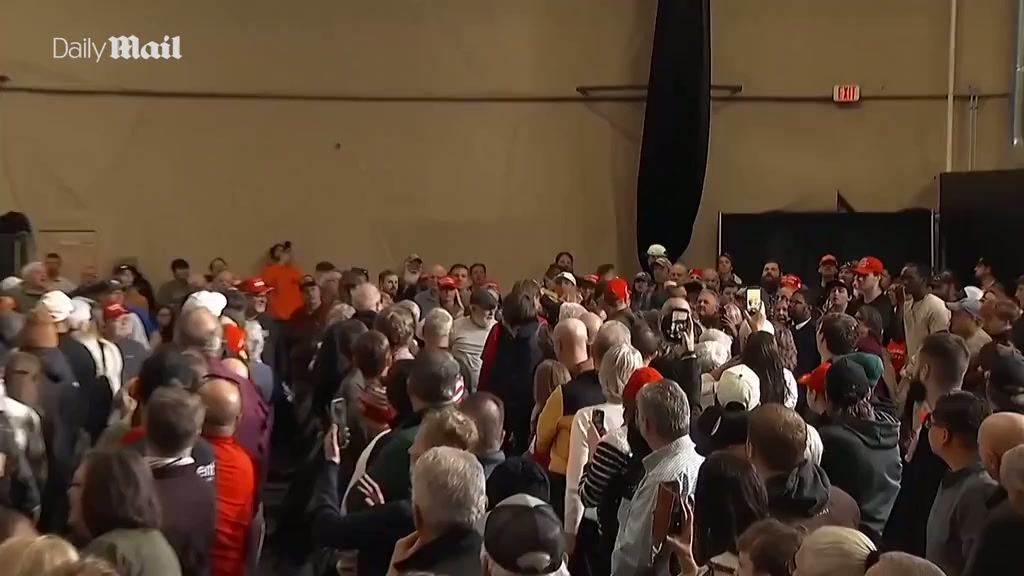 Moment 'paid agitators' are removed from Trump Iowa rally
