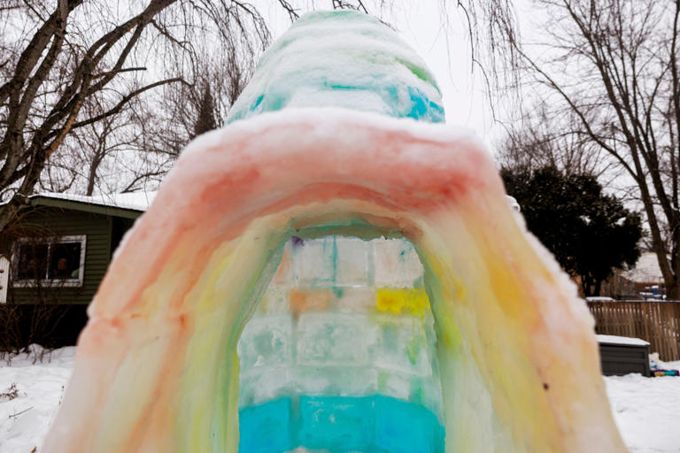 See the light-up rainbow igloo on this Ann Arbor family’s front lawn