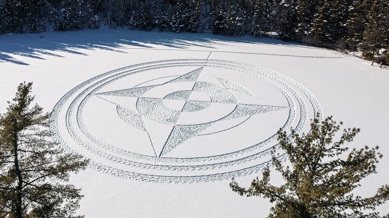 #TheMoment snowshoe artists created a compass in the snow