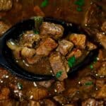 Slow Cooker Beef Tips and Onion Gravy in a crockpot featured image.