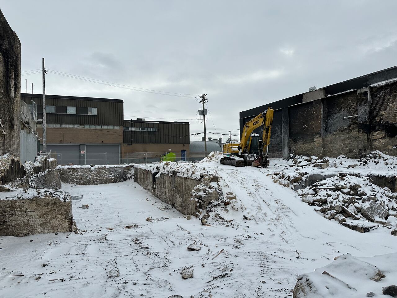Manwin Hotel rubble removal resumes after being halted due to asbestos