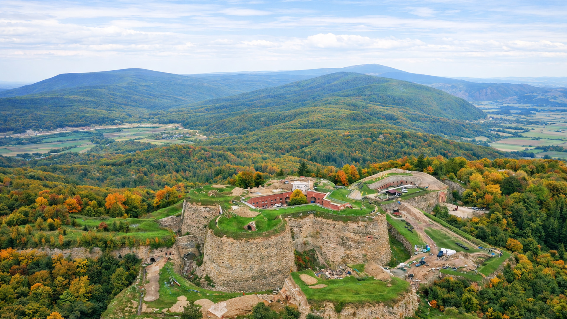 A mountain fortress rising over forests at Srebrna Gora