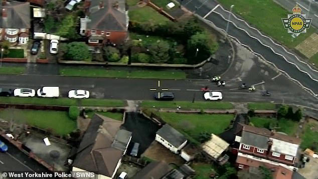 Moment police rider knocks suspect off his motorbike after 'gang's ...