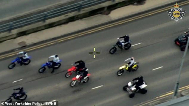 Moment police rider knocks suspect off his motorbike after 'gang's ...