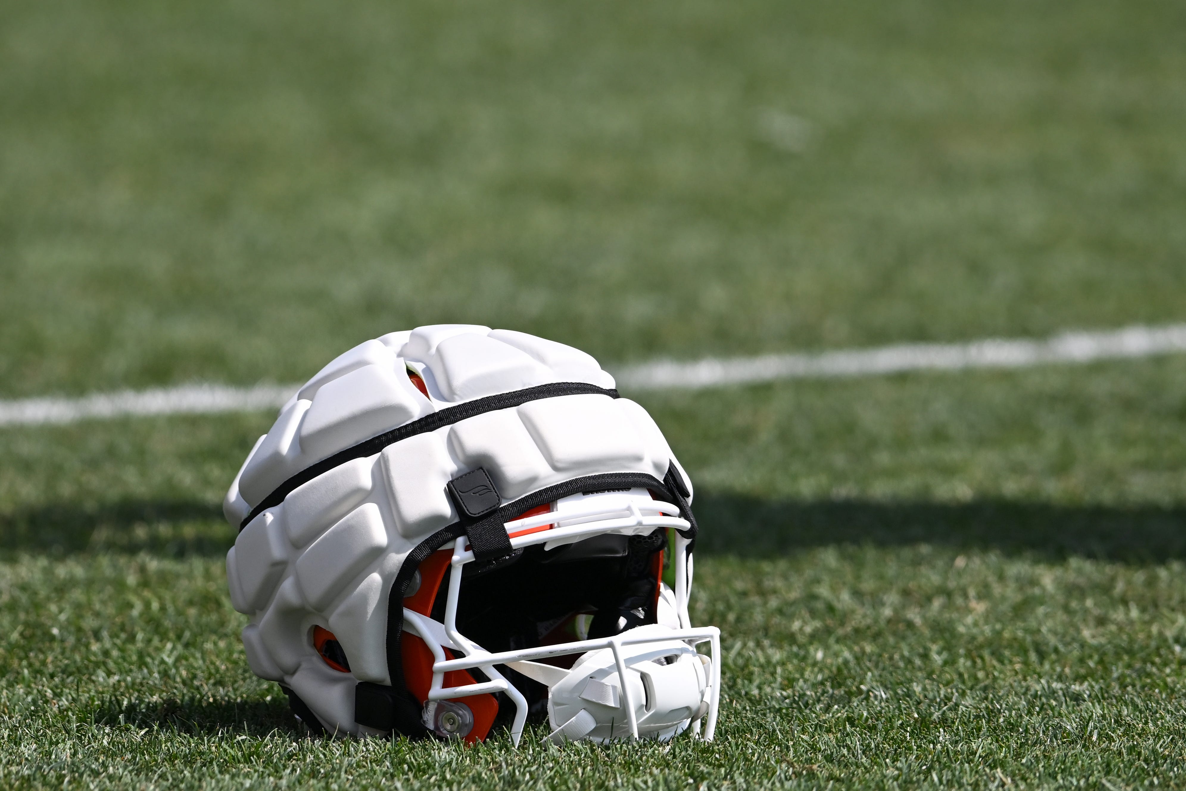 How effective are the Guardian Caps that NFL players wear?