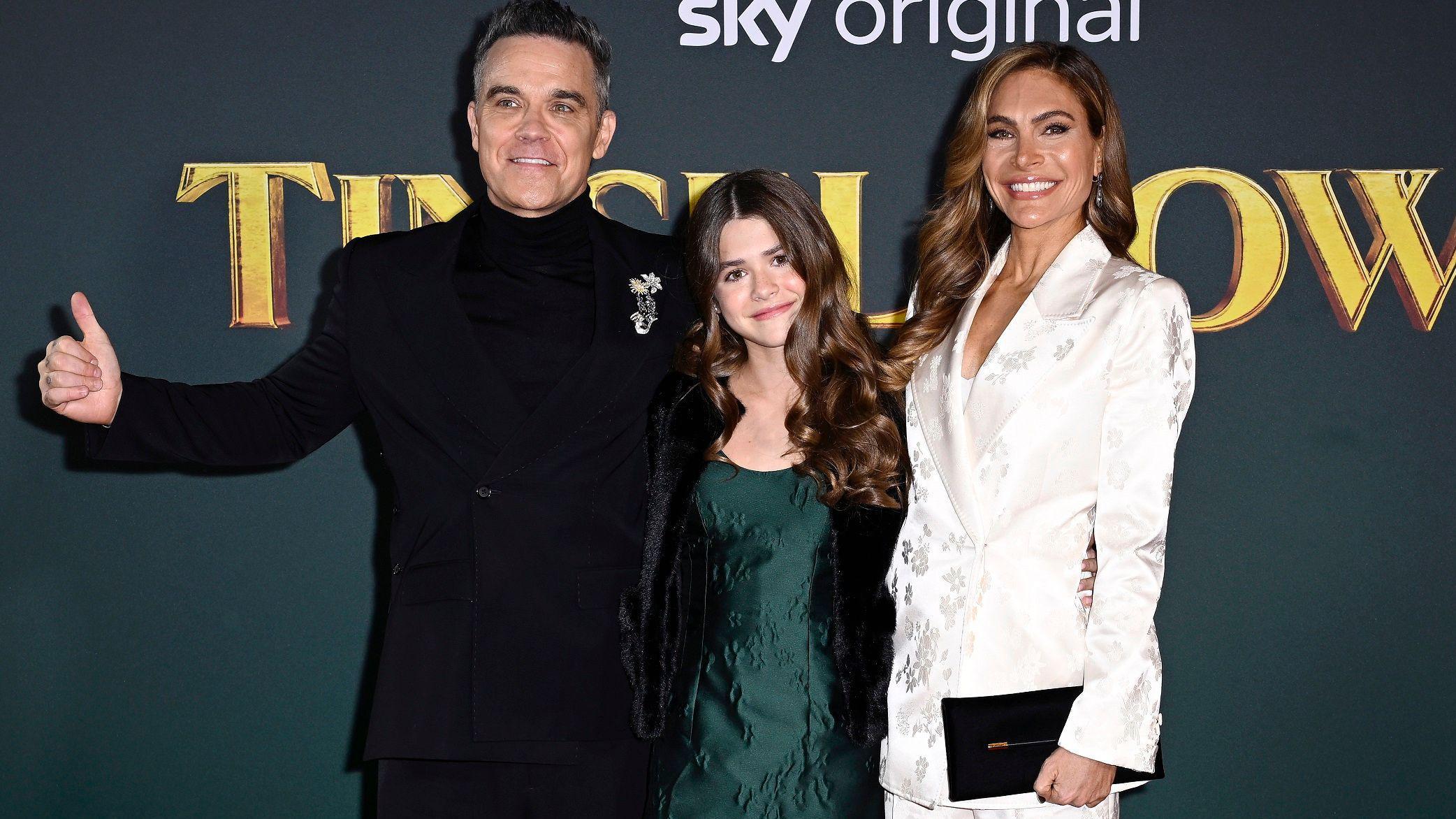 Robbie with his with Ayda and eldest daughter, Teddy, who was born in 2012