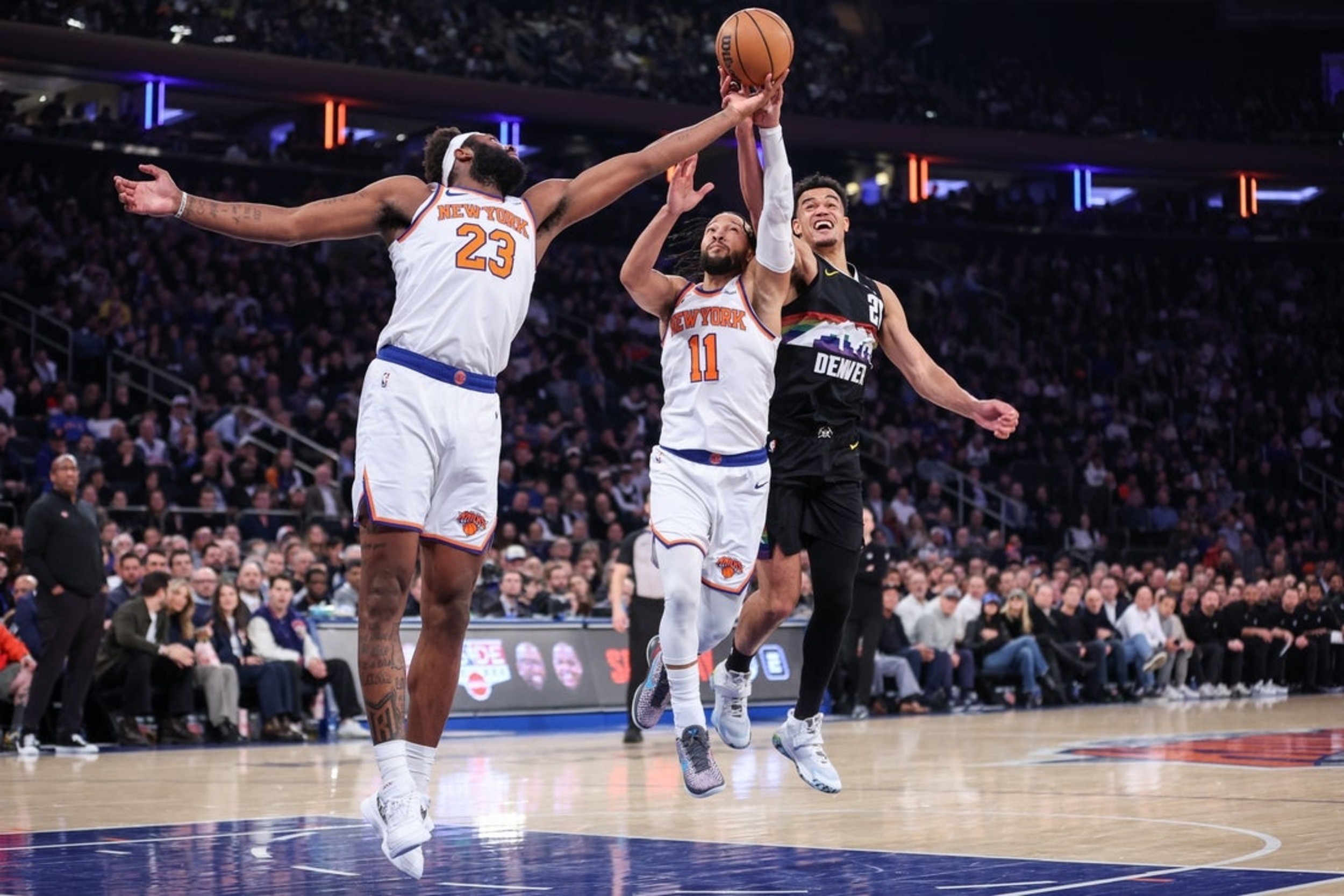 Knicks win eighth straight in double overtime clash with Nuggets