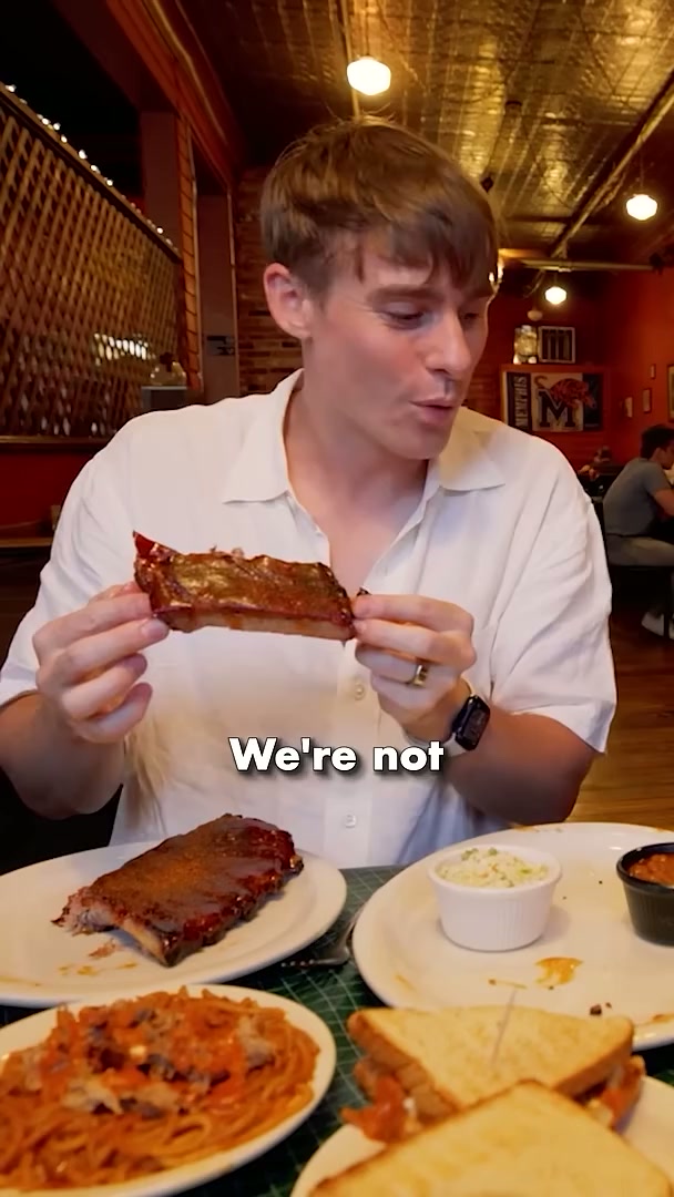 British guys experience Harlem's legendary soul food ribs—no knife needed!