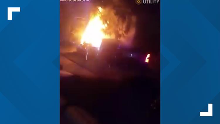 Watch: Indianapolis police officers rescue driver from burning truck