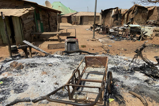 Burned homes and tools stand on an ash covered ground, days after an attack in the village of Woro, Nigeria. (Copyright 2026 The Associated Press. All rights reserved)