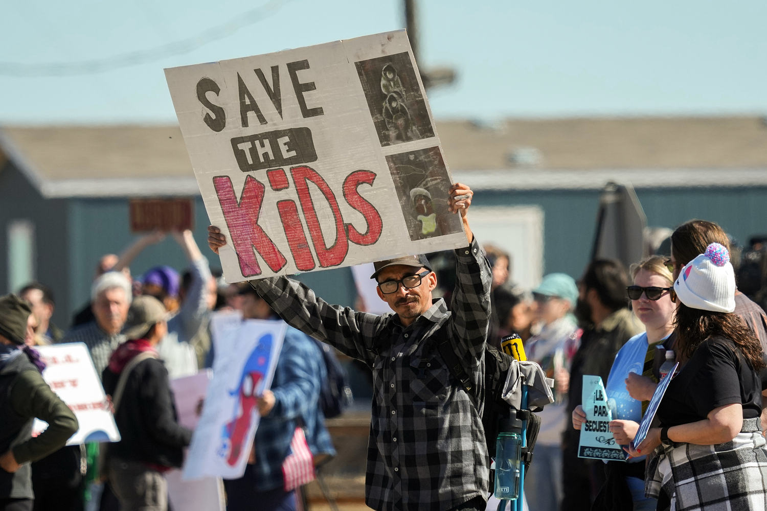 Demonstrators protest outside the Dilley Immigration Processing Center in January following Liam Conejo Ramos' detention. (Eric Gay / AP file)