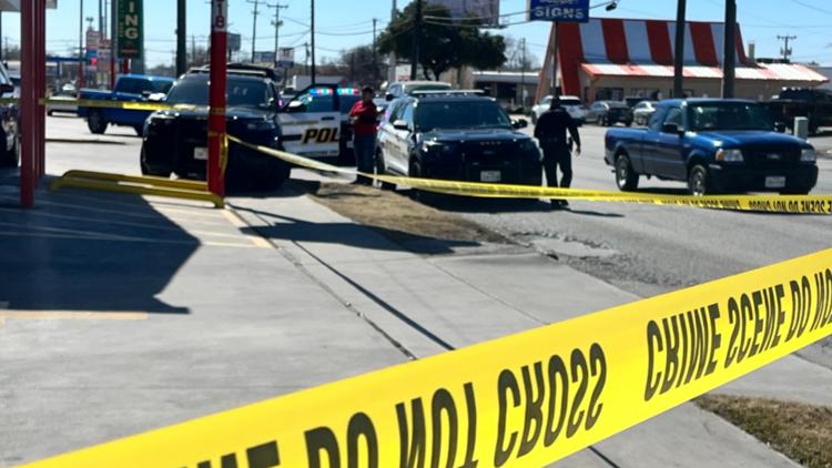 Woman run over by truck in parking lot north of downtown, police say