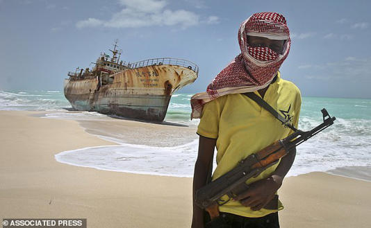 Pralav spent the next 331 days held hostage, alongside around 25 other crew members, as they were held for ransom and subjected to horrific abuse (stock image of a masked Somali pirate)