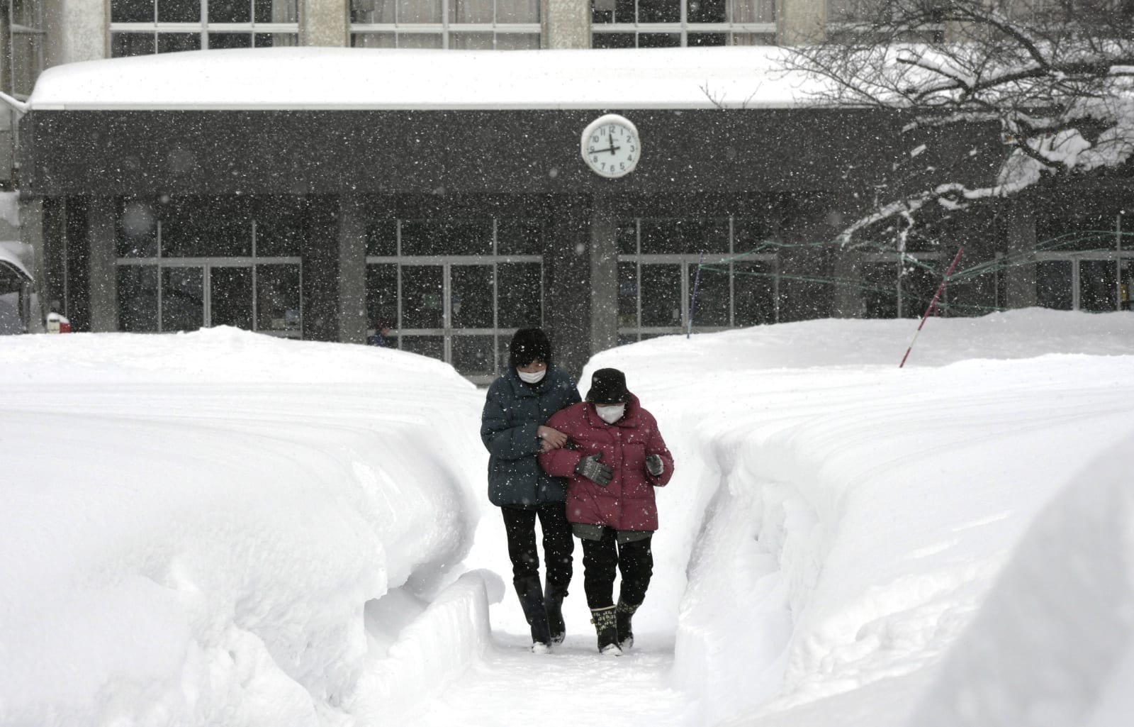 Heavy snow hampers voting in Japan as critics question midwinter election