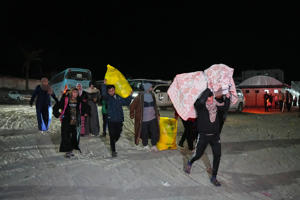 Palestinians attempt to cross between Gaza and Egypt at the Rafah border crossing<br><br>