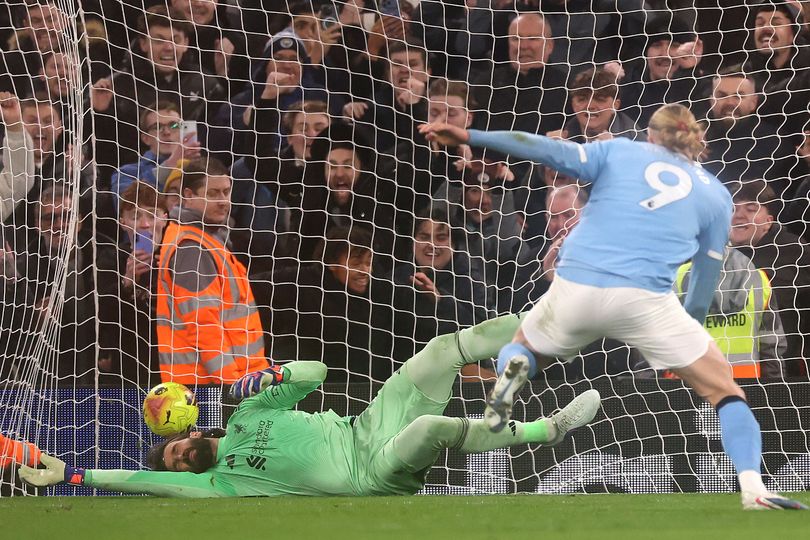 Alisson guessed the correct way but failed to save Erling Haaland's penalty