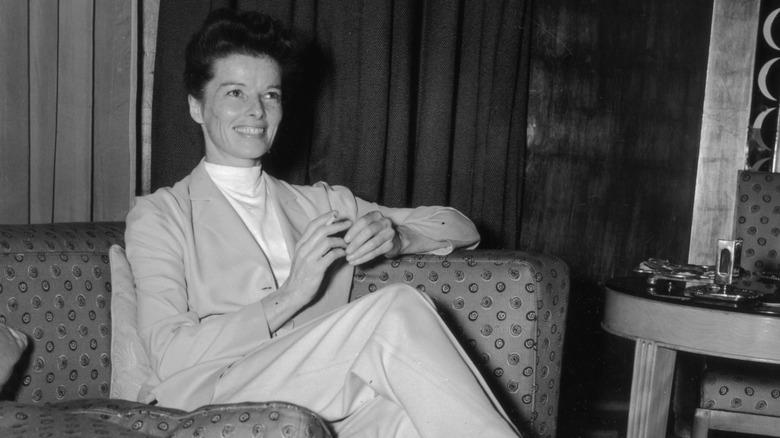 Black and white photo of Katharine Hepburn on couch