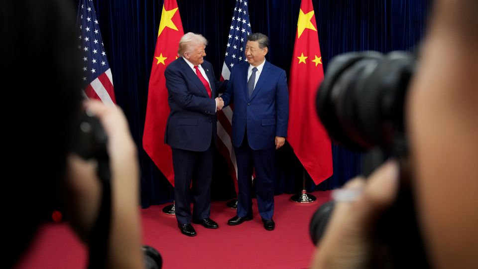 US President Donald Trump greets Chinese President Xi Jinping ahead of a bilateral meeting at Gimhae Air Base on October 30, 2025 in Busan, South Korea. - Andrew Harnik/Getty Images