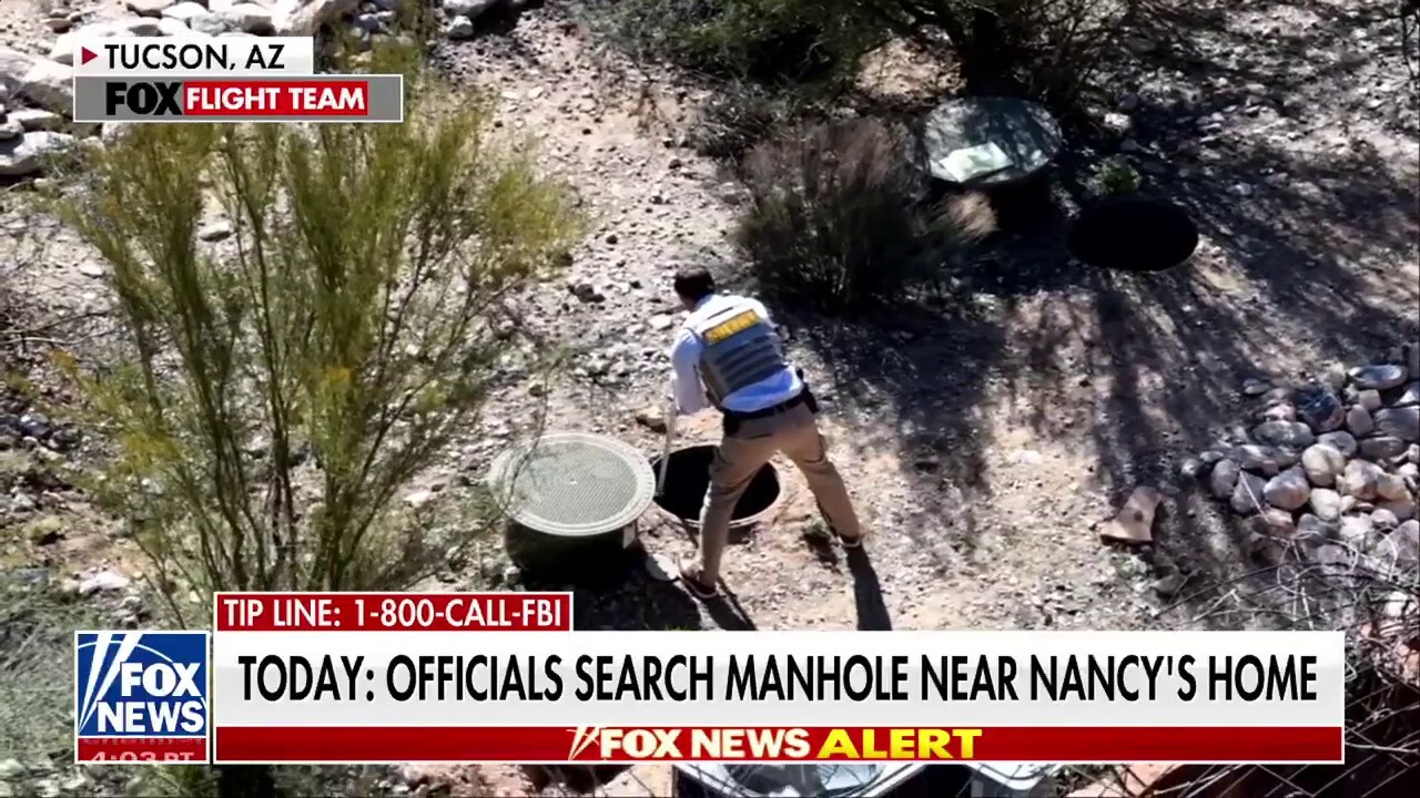 Investigators appeared to have been looking at manhole outside Nancy Guthrie