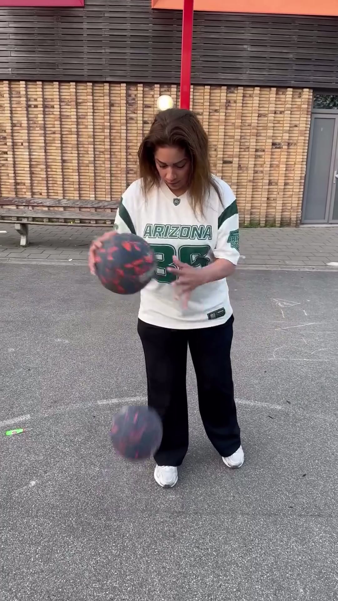 Skillful basketball dribbling and double ball trick shots outdoors