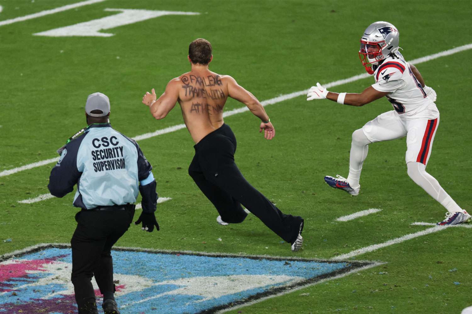 Security escorts streaker off the field at Super Bowl 2026 after ...