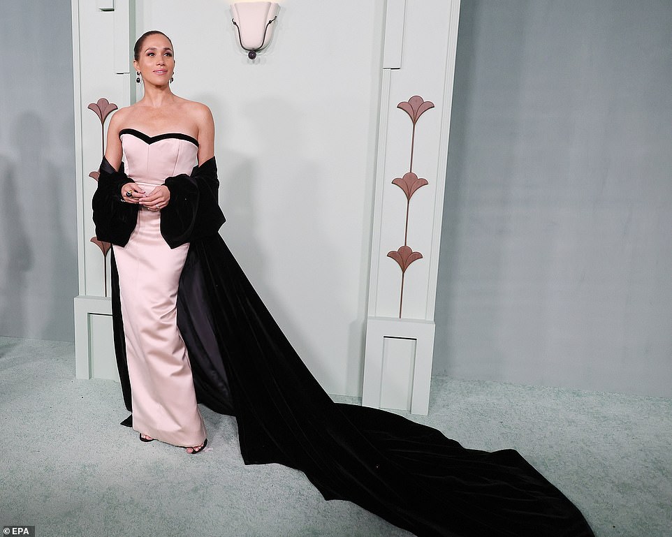 Meghan goes solo wearing pink strapless dress at fundraising gala