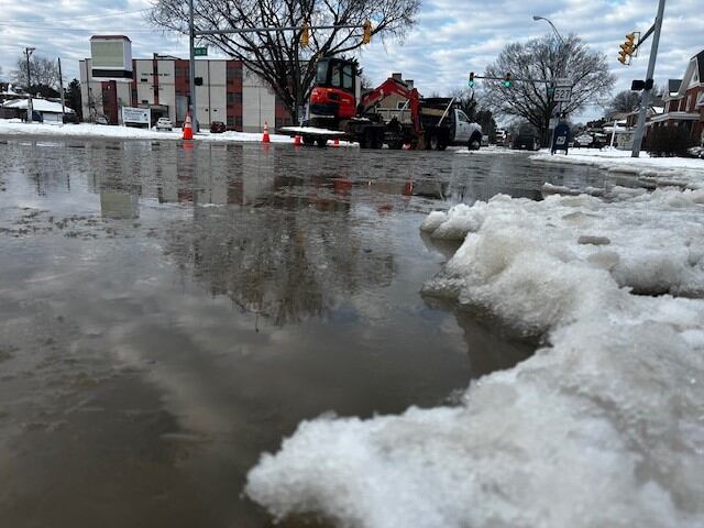 Water main break floods road