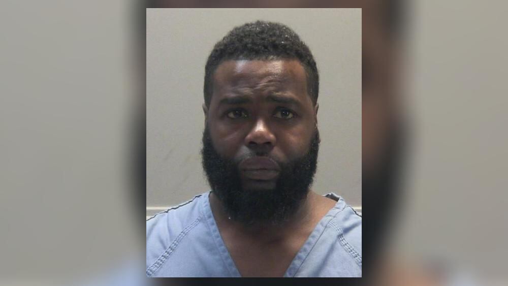 Woman shot while trying to break up fight; suspect in custody