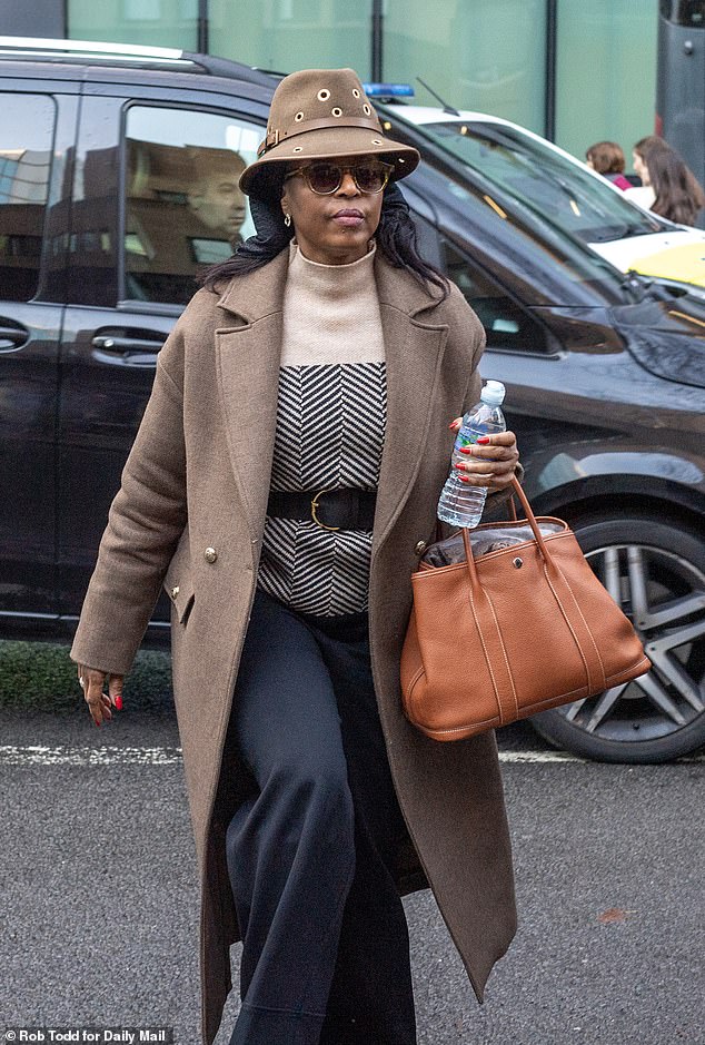 Diezani Alison-Madueke (seen outside court in London) faces claims she lived 'a life of luxury' in the UK at properties paid for by energy industry figures seeking government contracts