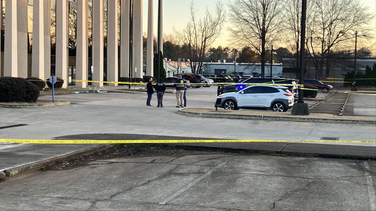 Woman injured in shooting involving officer outside Cobb County police ...
