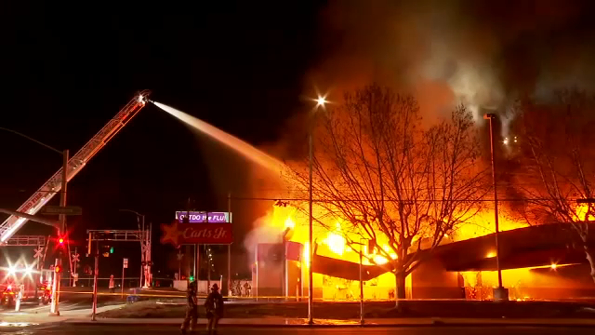 Massive fire rips through former Carl's Jr. location near Fresno City ...