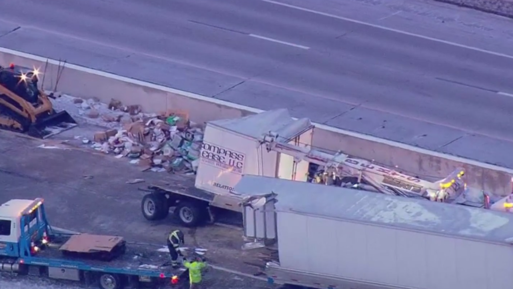 I-65 reopens after US mail trailer crashes, splits open