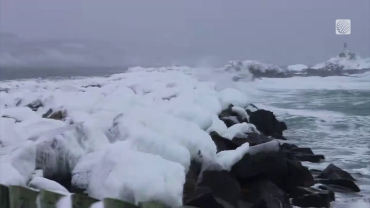 Waves crash with strong winds in this ice cold scene