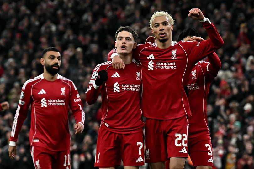 Liverpool's German midfielder #07 Florian Wirtz celebrates scoring the team's second goal with Liverpool's French striker #22 Hugo Ekitike (2R) during the UEFA Champions League football match between Liverpool and Qarabag at Anfield in Liverpool, north west England on January 28, 2026. (Photo by Paul ELLIS / AFP via Getty Images)