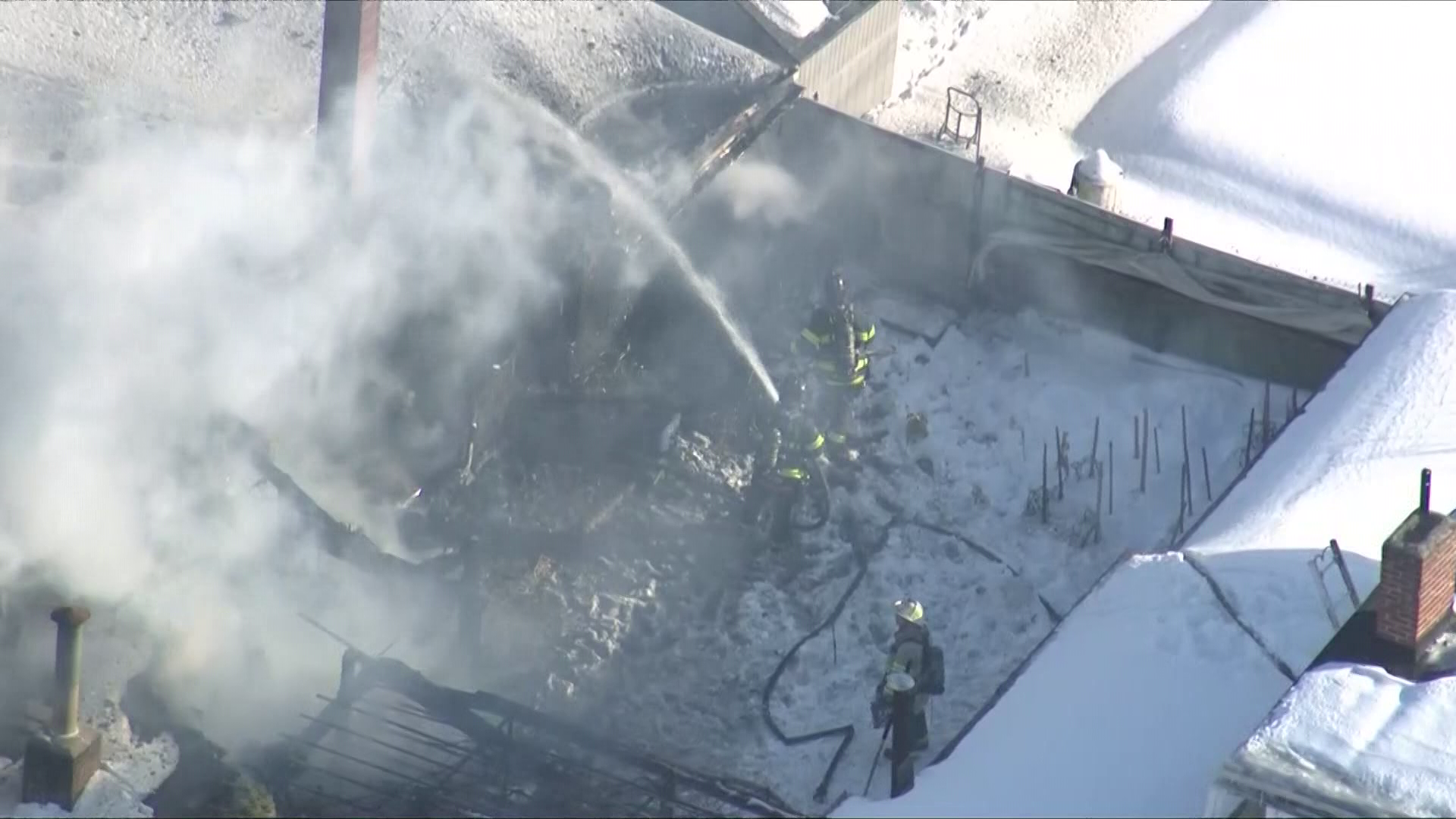 Crews battle 2-alarm fire, smoky conditions and ice at Mass. fire