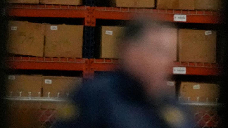 An FBI employee stands inside the Fulton County Election Hub on Wednesday, January 2026. - Mike Stewart/AP