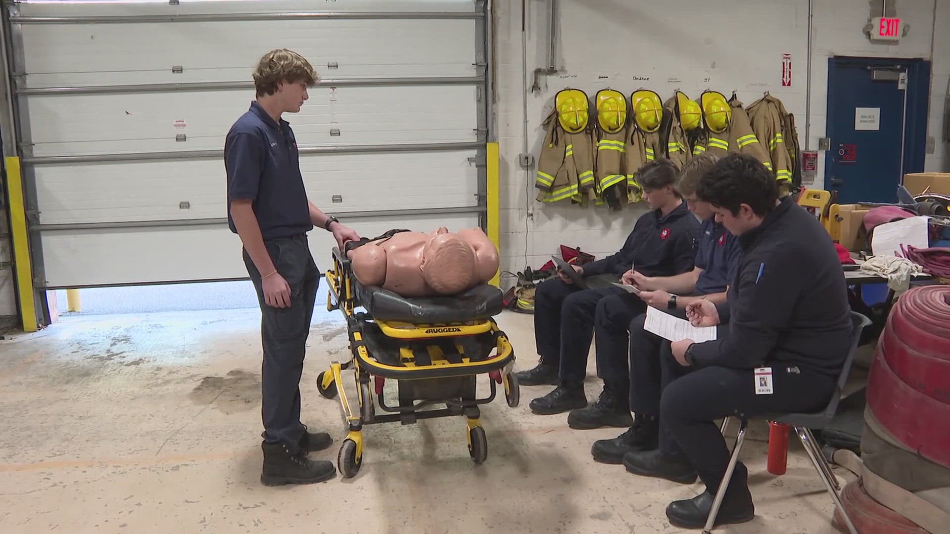 High school EMT trainers render aid for injured student