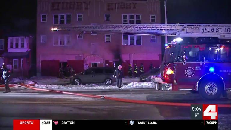Person hospitalized after being rescued from burning building with ...